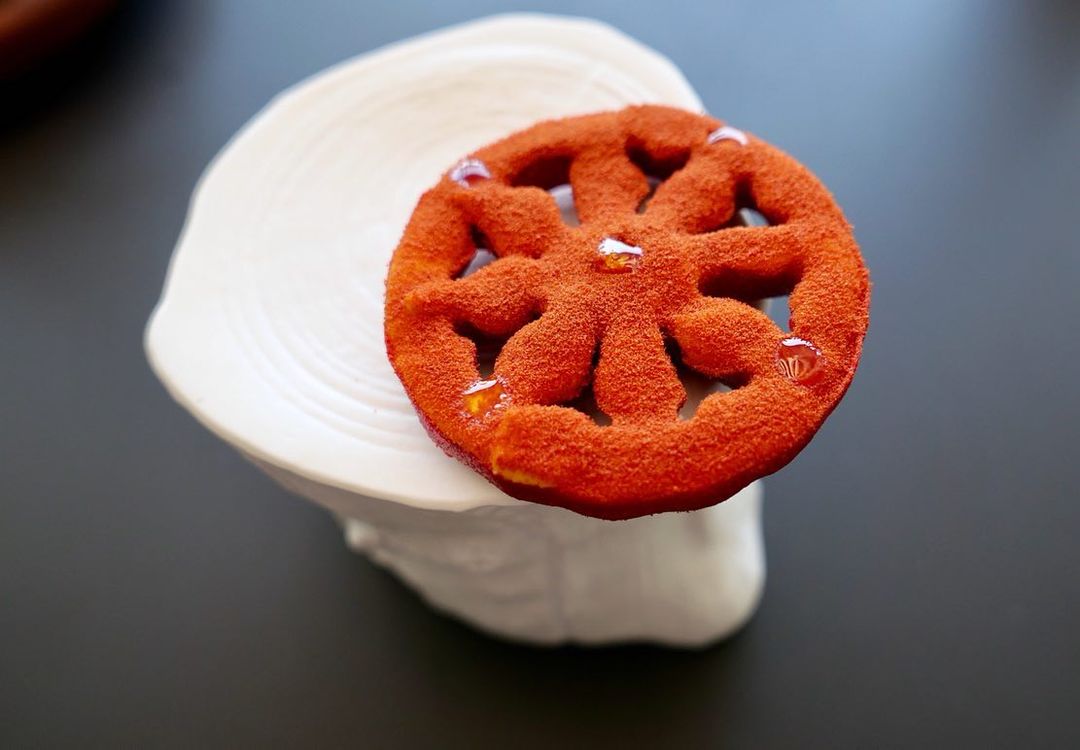 Slice of "tomato" sprinkled with rice vinegar