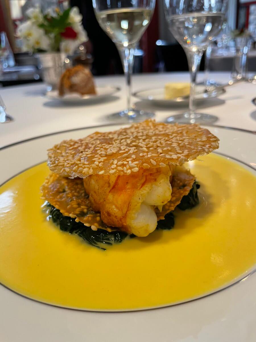 Feuillantine de langoustines with sesame seeds and curry sauce at L'Ambrosie, Paris